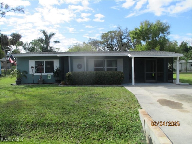 ranch-style home with an attached carport, a front lawn, concrete driveway, and stucco siding