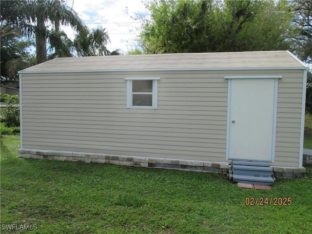 view of outbuilding with entry steps and an outbuilding