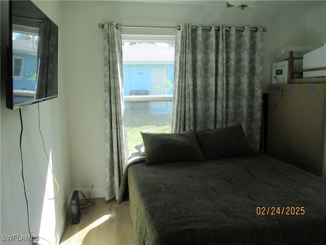 bedroom featuring wood finished floors