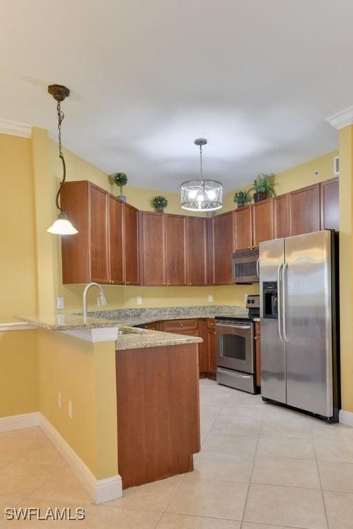 kitchen featuring light tile patterned floors, a peninsula, light stone countertops, stainless steel appliances, and pendant lighting