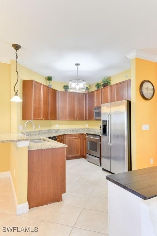 kitchen featuring appliances with stainless steel finishes, ornamental molding, a peninsula, hanging light fixtures, and a sink