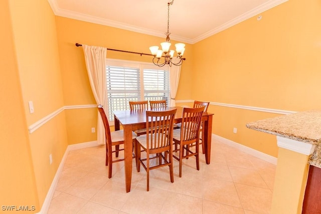 dining room featuring a chandelier, ornamental molding, light tile patterned floors, and baseboards