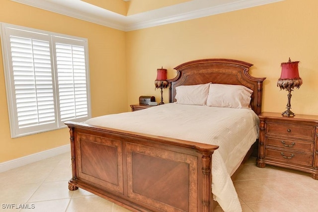 bedroom featuring baseboards, light tile patterned floors, and crown molding