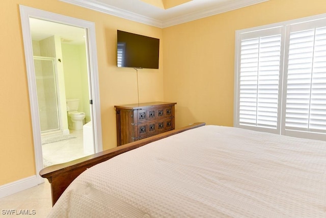 bedroom with ensuite bathroom, ornamental molding, tile patterned flooring, and baseboards