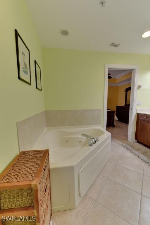 bathroom featuring a garden tub, recessed lighting, visible vents, vanity, and tile patterned floors