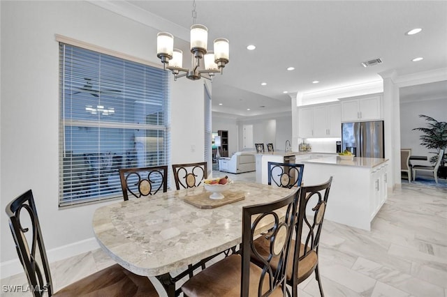 dining room featuring recessed lighting, visible vents, marble finish floor, ornamental molding, and an inviting chandelier