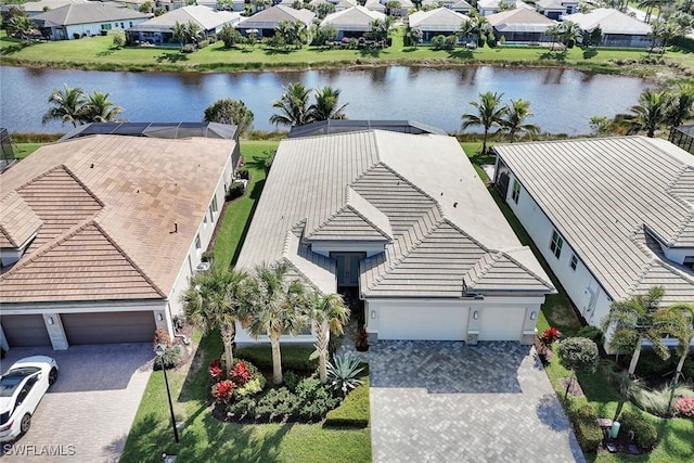 bird's eye view featuring a water view and a residential view