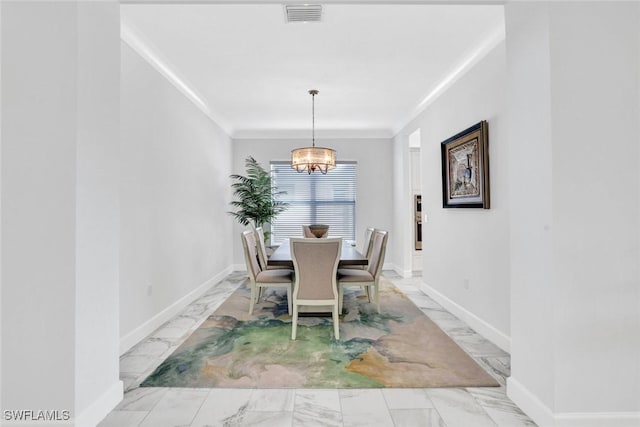 dining area featuring marble finish floor, visible vents, an inviting chandelier, ornamental molding, and baseboards