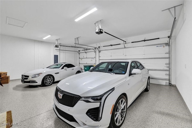 garage featuring electric panel and a garage door opener