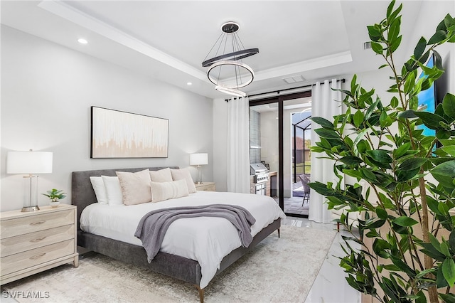 bedroom featuring access to exterior, recessed lighting, a raised ceiling, and marble finish floor