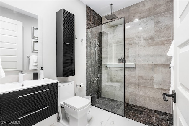 bathroom with marble finish floor, vanity, toilet, and walk in shower