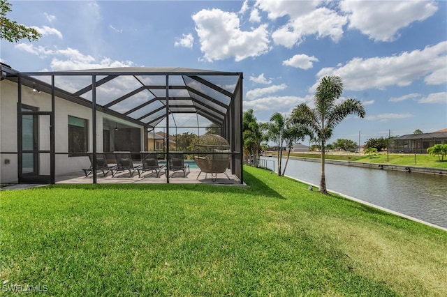 exterior space with a lanai, a water view, and a patio area