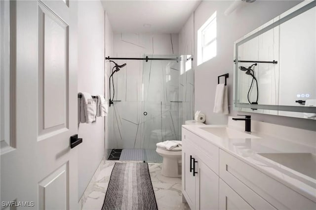 bathroom with toilet, a sink, marble finish floor, a marble finish shower, and double vanity