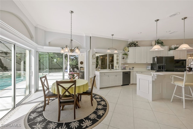 dining area featuring ornamental molding, a notable chandelier, and light tile patterned floors