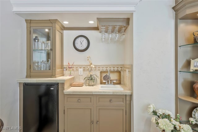 bar with recessed lighting, indoor bar, a sink, backsplash, and freestanding refrigerator