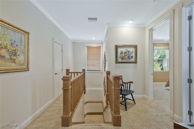 corridor with baseboards, visible vents, light carpet, and an upstairs landing