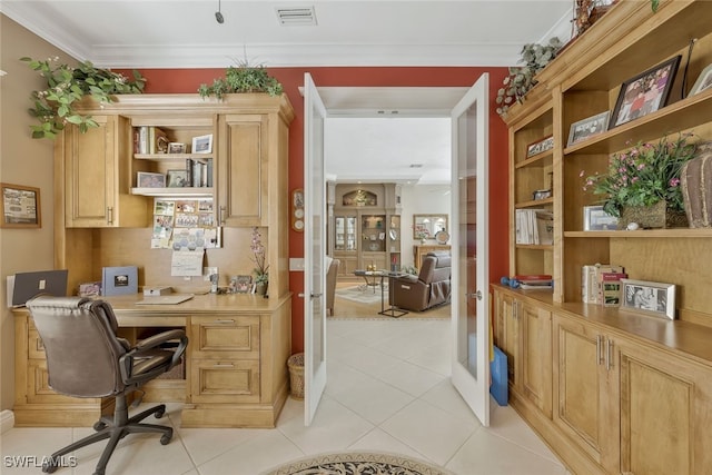 office area featuring visible vents, crown molding, built in study area, and light tile patterned floors