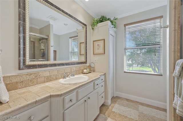 full bath with crown molding, vanity, and a healthy amount of sunlight