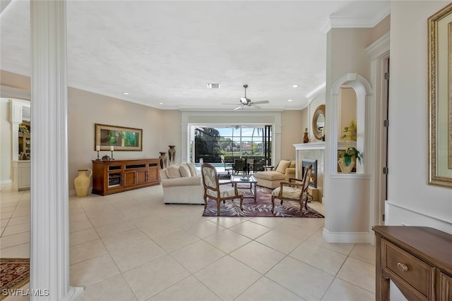 living room with light tile patterned floors, recessed lighting, a ceiling fan, a lit fireplace, and ornamental molding