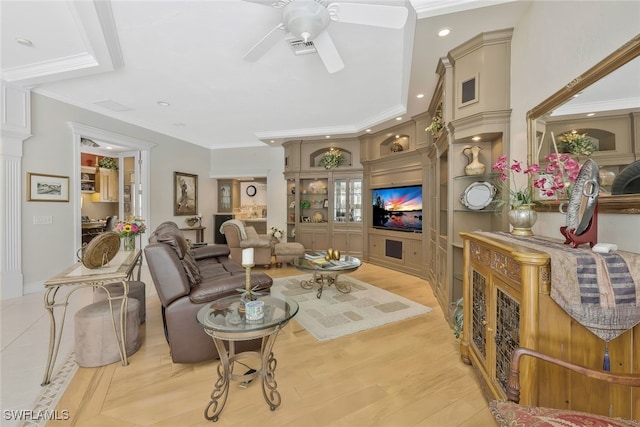 living area featuring light wood-style floors, ceiling fan, and crown molding