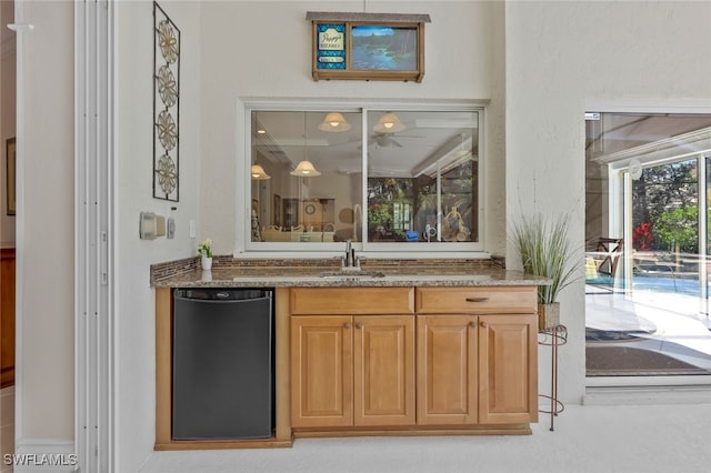 bar featuring a sink and dishwasher