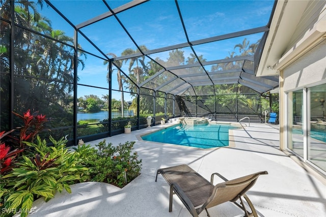 pool with a water view, glass enclosure, and a patio area