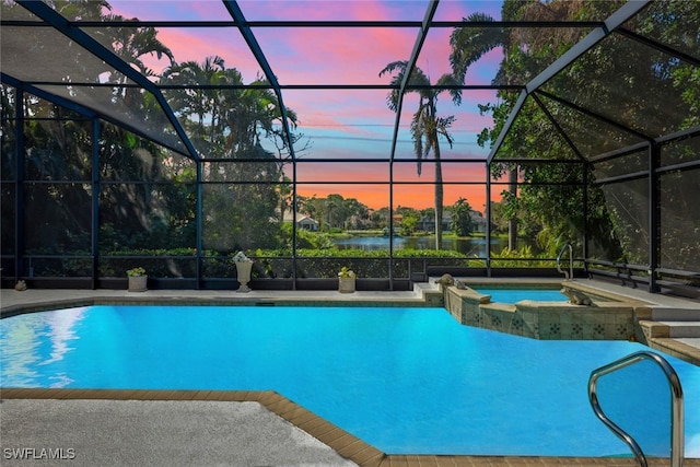 view of pool featuring a patio, a lanai, and a pool with connected hot tub