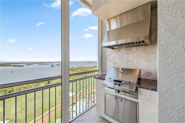 balcony featuring a water view and area for grilling