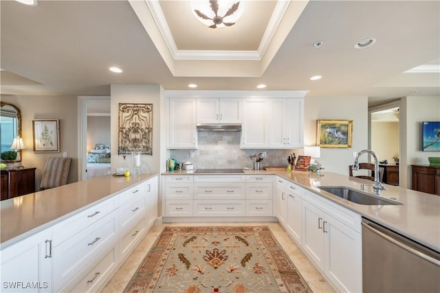 kitchen featuring dishwasher, ornamental molding, a peninsula, a tray ceiling, and a sink