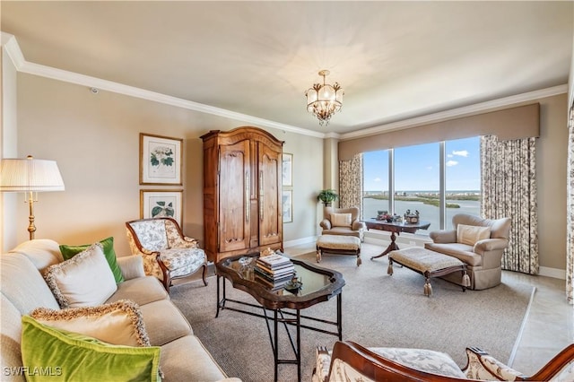 living room with ornamental molding, a water view, a notable chandelier, and baseboards