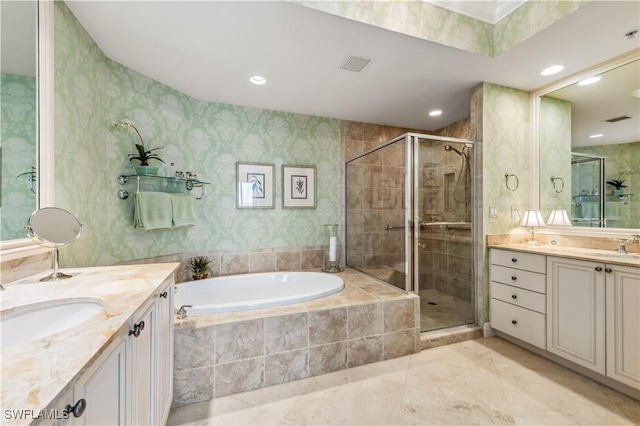 full bathroom featuring a garden tub, a shower stall, visible vents, and two vanities