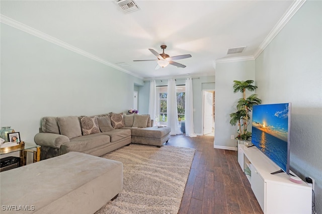 living room with a ceiling fan, dark wood finished floors, visible vents, and crown molding