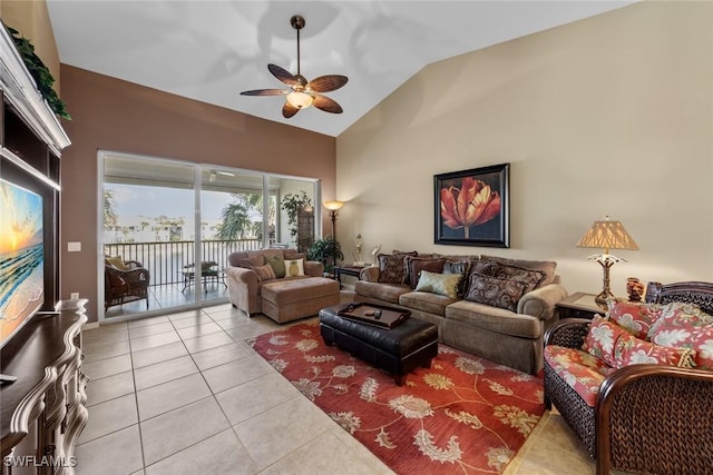 living room with high vaulted ceiling, light tile patterned flooring, and a ceiling fan