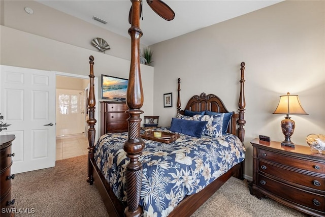 bedroom featuring visible vents, ceiling fan, and carpet flooring