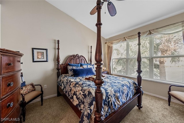 bedroom featuring a ceiling fan, lofted ceiling, light colored carpet, and baseboards