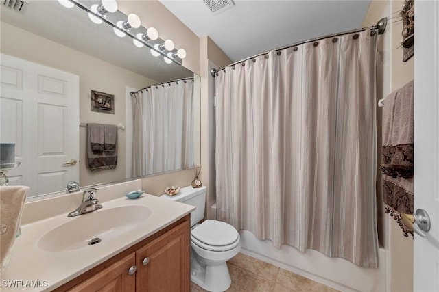 full bathroom featuring toilet, vanity, visible vents, and tile patterned floors