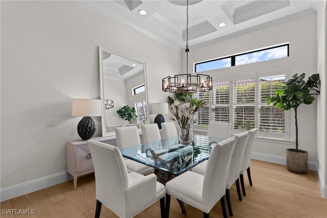 dining room featuring light wood-style flooring, baseboards, coffered ceiling, and crown molding