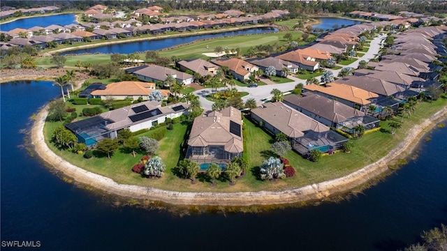 bird's eye view featuring a water view and a residential view