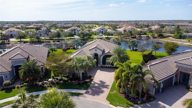 birds eye view of property featuring a residential view and a water view