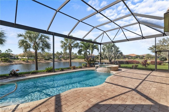 view of pool with glass enclosure, a patio area, a pool with connected hot tub, and a water view