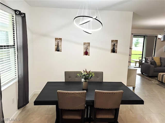 dining area with light tile patterned flooring