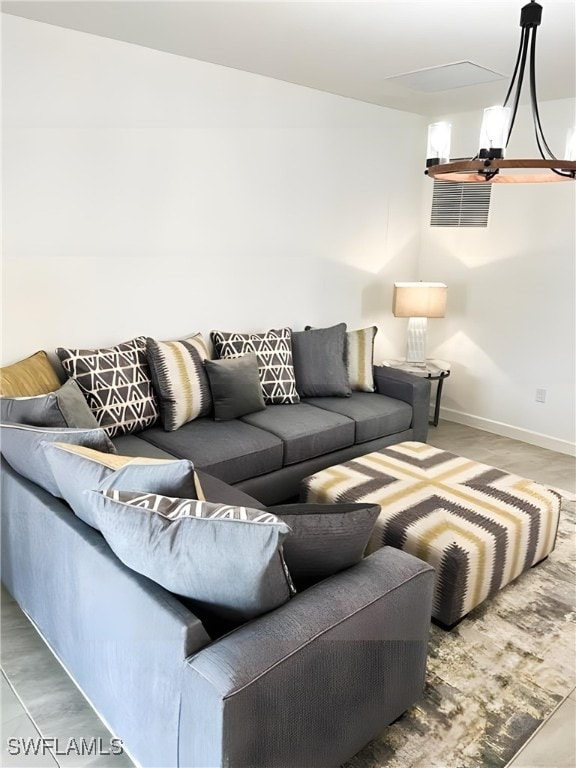 living room featuring baseboards and wood finished floors