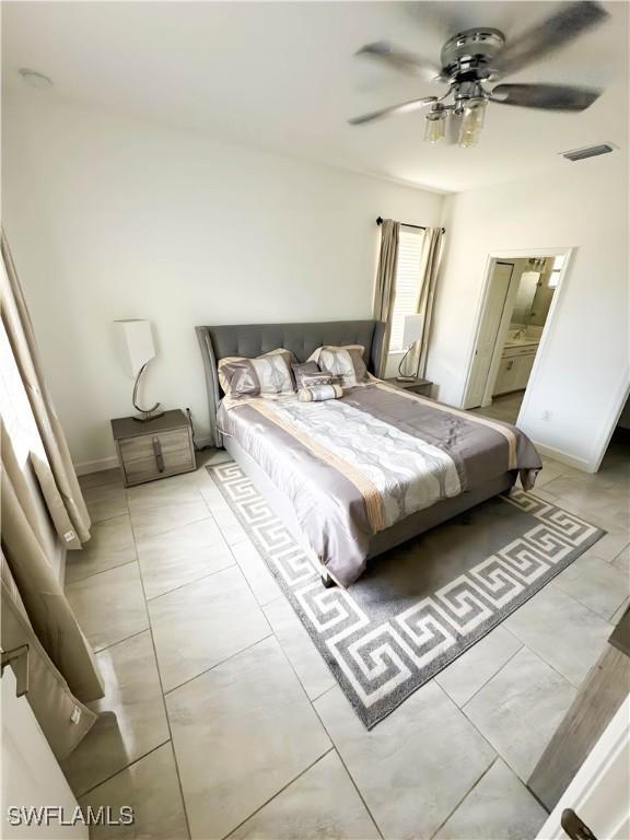 tiled bedroom featuring ceiling fan and visible vents