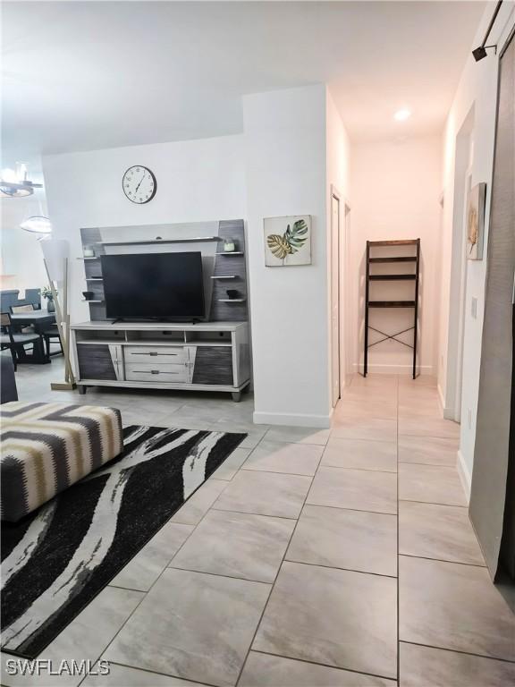 18297 Ridgeline Dr, Estero, FL 33928 - living area with baseboards and light tile patterned floors