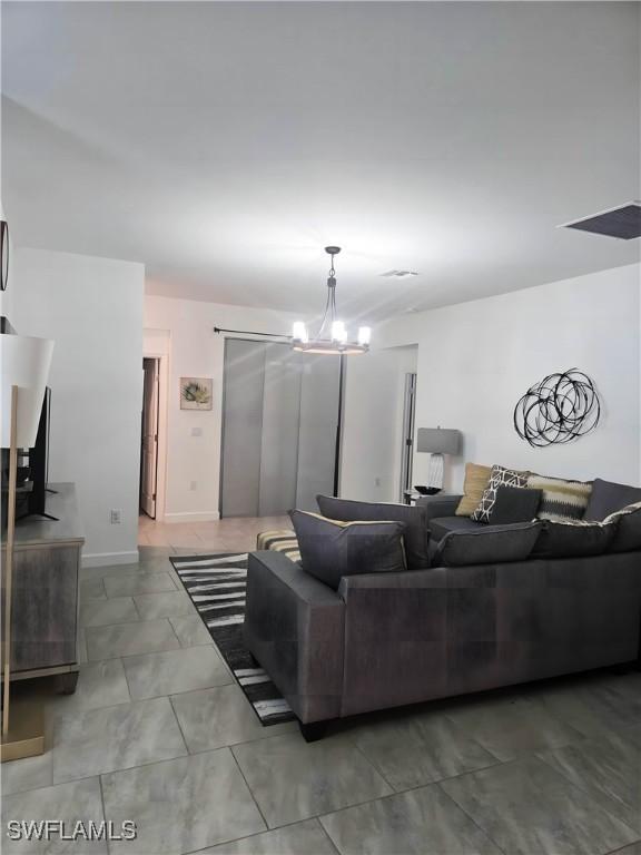 18297 Ridgeline Dr, Estero, FL 33928 - living area with a chandelier