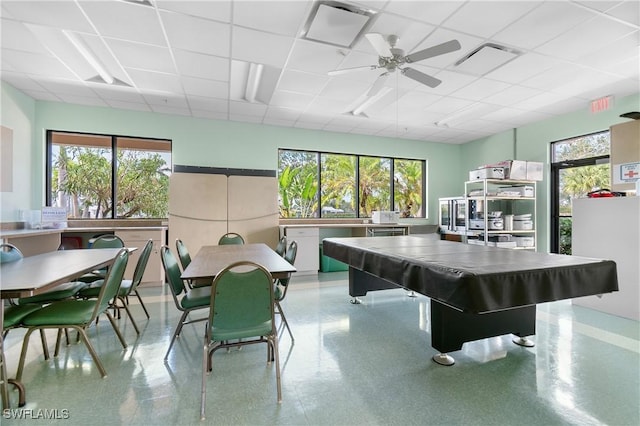 playroom featuring a healthy amount of sunlight, visible vents, ceiling fan, and a drop ceiling