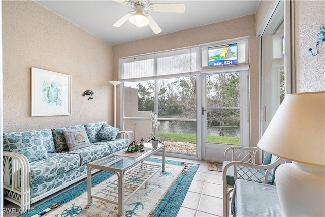 sunroom / solarium with a ceiling fan