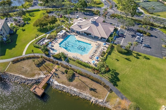 birds eye view of property with a water view