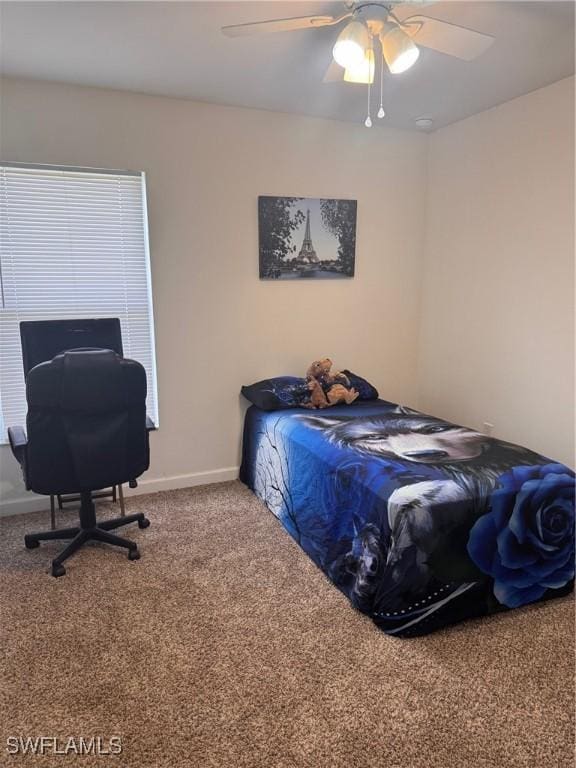 bedroom featuring carpet flooring, a ceiling fan, and baseboards