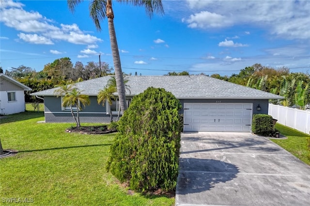 ranch-style house with brick siding, concrete driveway, a front yard, fence, and a garage